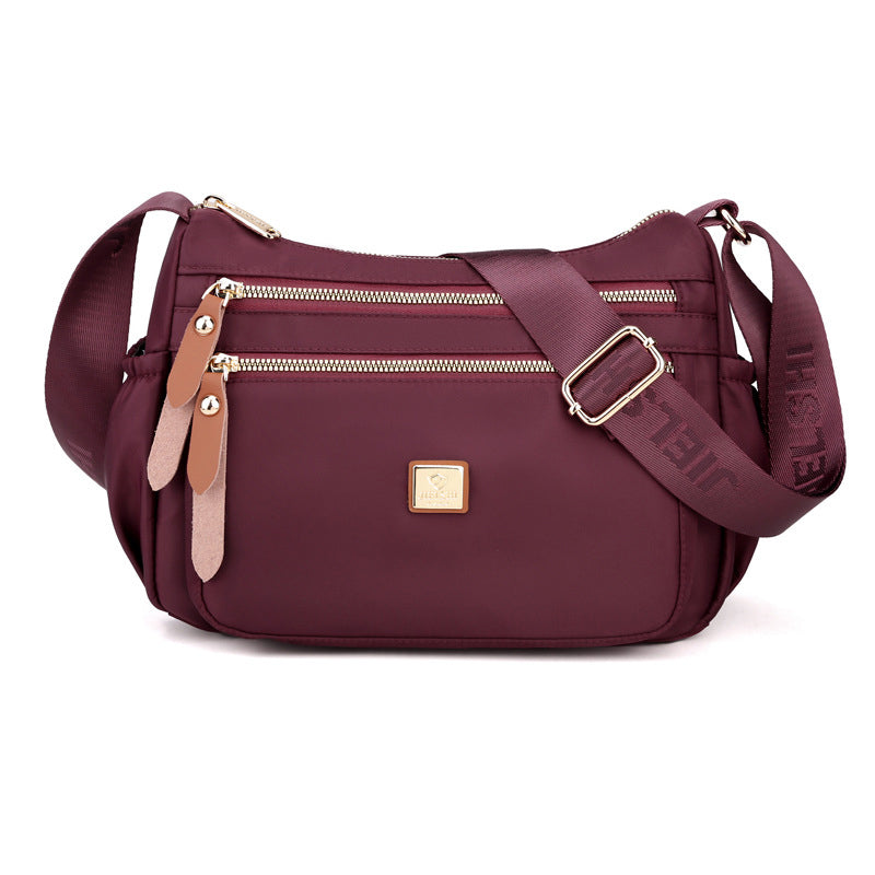 Multi-compartment shoulder bag