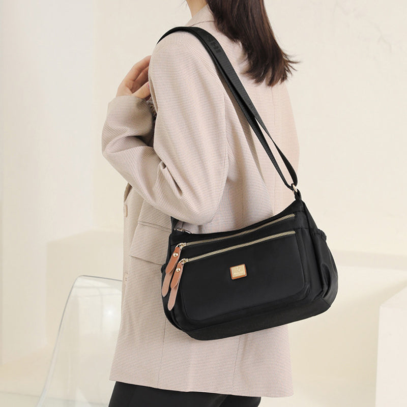 Multi-compartment shoulder bag